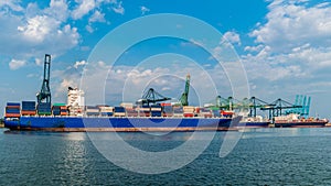 Antwerp, Belgium, view of harbor cranes and container ships in the largest dock of the port Antwerp