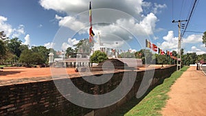 Anuradhapura, Sri Lanka, fence with flags and dome