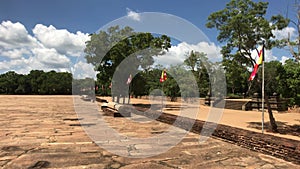 Anuradhapura, Sri Lanka, the view of the flags outside of Dagobah