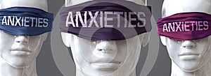 Anxieties can blind our views and limit perspective - pictured as word Anxieties on eyes to symbolize that Anxieties can distort