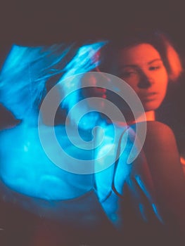 anxiety attack disturbed woman in red blue light