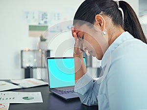 Anxiety, stress and laptop screen with green screen and mockup in a office at a company desk. Business woman with