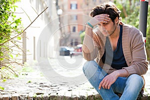 Anxiety. Thoughtful young man anxious, outdoors photo