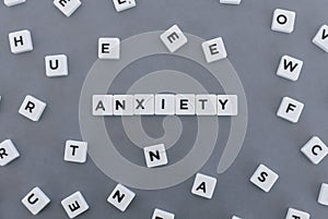 Anxiety word made of square letter word on grey background