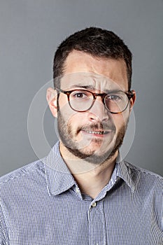 Anxious bearded entrepreneur frowning for business stress and anxiety