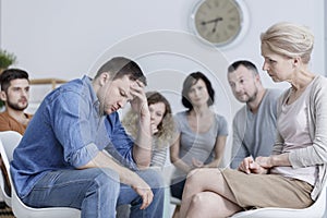 Anxious man holding head