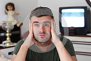 Anxious man watching tv static
