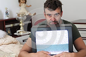 Anxious man watching tv static