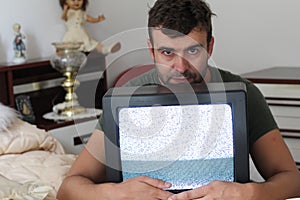 Anxious man watching tv static