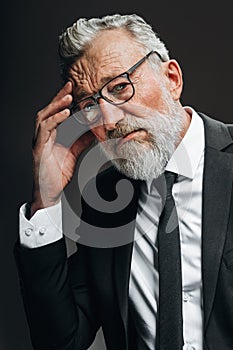 Anxious mature business man being worried after having stressful negotiations.