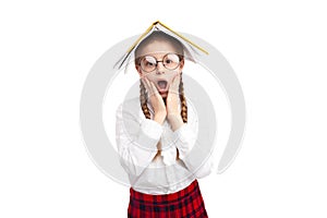 Anxious nerdy girl with textbook on head