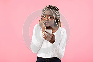 Anxious scared black woman looking at phone seeing bad news