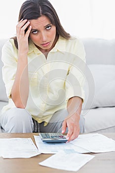 Anxious woman doing her accounts