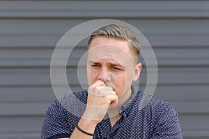 Anxious worried young man frowning