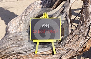 Any questions symbol. Concept words Any questions on beautiful black yellow blackboard. Beautiful tree background. Business and