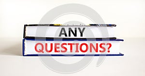 Any questions symbol. Concept words Any questions on books on a beautiful white table white background. Business and Any questions