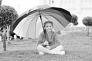 Any weather is good. Rainbow after rain. Multicolored umbrella for little happy girl. Positive mood in autumn weather