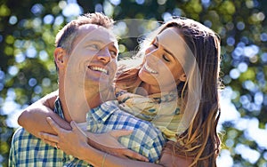 Anyone can see theyre in love. an affectionate couple embracing in the summer sun.