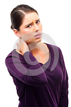 Anyone offering a neck and shoulder massage. Studio shot of a young woman in pain isolated on white.