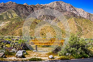 Anza-Borrego Desert State Park Visitor Center sign surrounded by wildflowers during a spring superbloom, south California