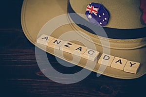 Anzac army slouch hat with Australian Flag on vintage wood