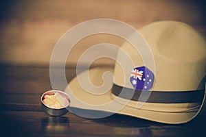 Anzac army slouch hat with Australian Flag on vintage wood background