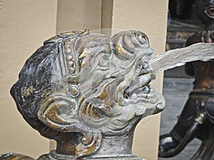 Ao-Nang, THAILAND - December 24, 2018: Sculpture head satyr spews a fountain of water
