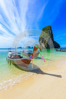 Ao Phra Nang Beach - Thai traditional wooden longtail boat on Railay Peninsula in front of Limestone karst rocks, close to Ao Nang