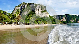 Aonang beach with limestone rock