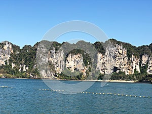 Aonang, Krabi / Thailand - February 11, 2019: Aonang Beach, the beautiful and famous place in Thailand, blue sky and green sea.