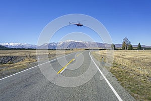 AORAKI MOUNT COOK, NEW ZEALAND 16TH APRIL 2014; Unidentified helicopter flying over the amazing South Island, New Zealand