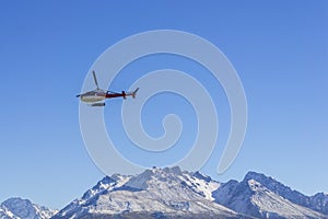 AORAKI MOUNT COOK, NEW ZEALAND 16TH APRIL 2014; Unidentified helicopter flying over the amazing South Island, New Zealand