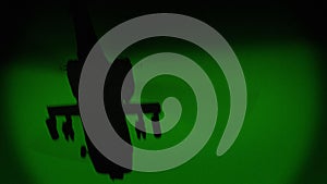 Apache AH-64 helicopter flies at night, night vision infrared