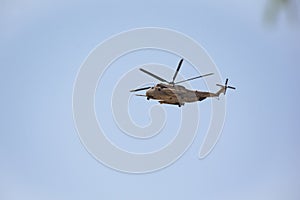 Apache Helicopter Flying over the Desert