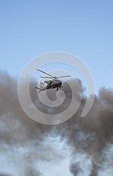 Apache helicopter in a warzone