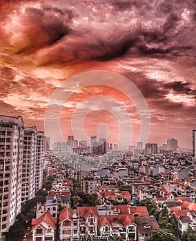 Apartment block in Vietnam with blood red sky and clouds photo