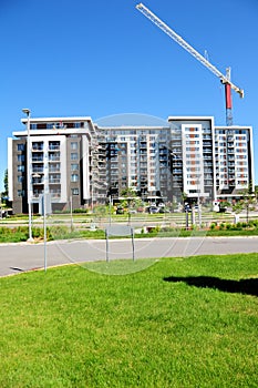 Apartment building, crane, Canada vertical