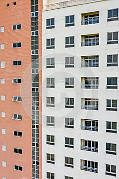 Apartment building exterior with sloughing paint on the wall