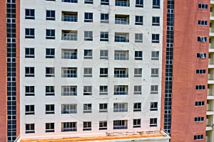 Apartment building exterior with sloughing paint on the wall