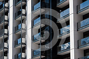 Apartment building front facade with balconies