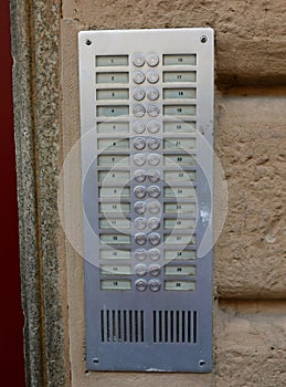 apartment building intercom system with 30 buttons to call apartments