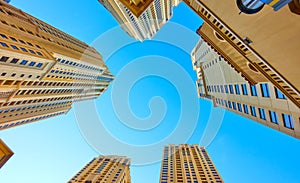 Apartment buildings against the blue sky