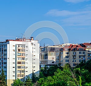 Apartment buildings with balconies and blue sky