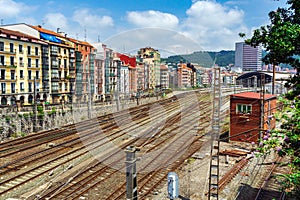 Apartment buildings located near a major railway junction. Railway rails near a residential area, Bilbao, Spain