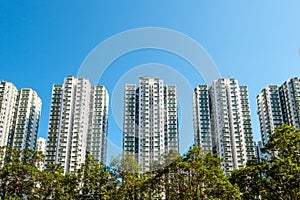 Apartment buildings, residential real estate and blue sky copy space