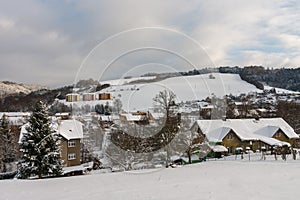 Apartment buildings on in small town, winter morning, after snow falling