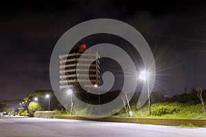 Apartment buliding and empty parking lot at night