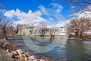 Apartment complex on the shoreline of Truckee River, Reno, Nevada; increased water level due to snow melt