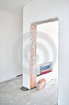 Apartment construction site, doorway and underfloor heating wiring center