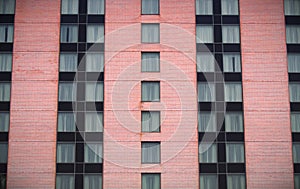 Apartment hotel building pink brick modern windows residential skyscraper